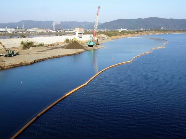 silt curtain installed in water to contain sediment during construction
