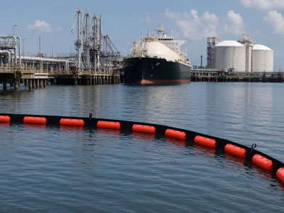 Floating oil containment boom deployed on port water surface