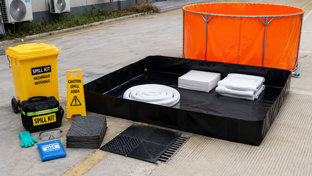 Complete spill response equipment including spill containment berm and absorbents