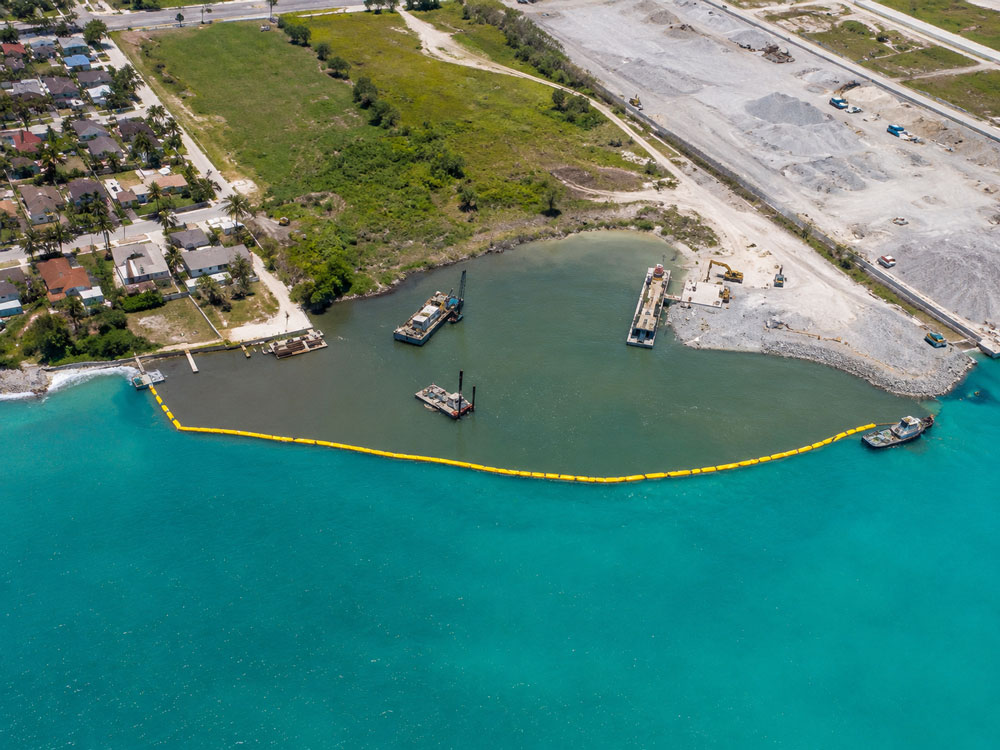 silt curtain deployed around dredging equipment