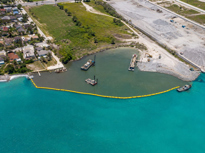 Silt curtain controlling sediment during dredging