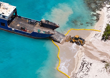 Heavy duty silt curtain installed around marine dredging project