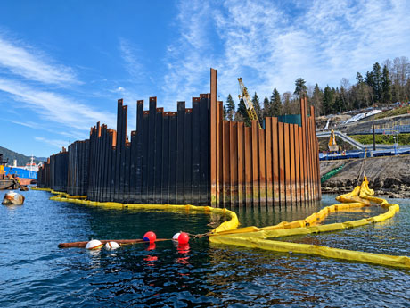 Dredging operations at a marine construction site requiring sediment control